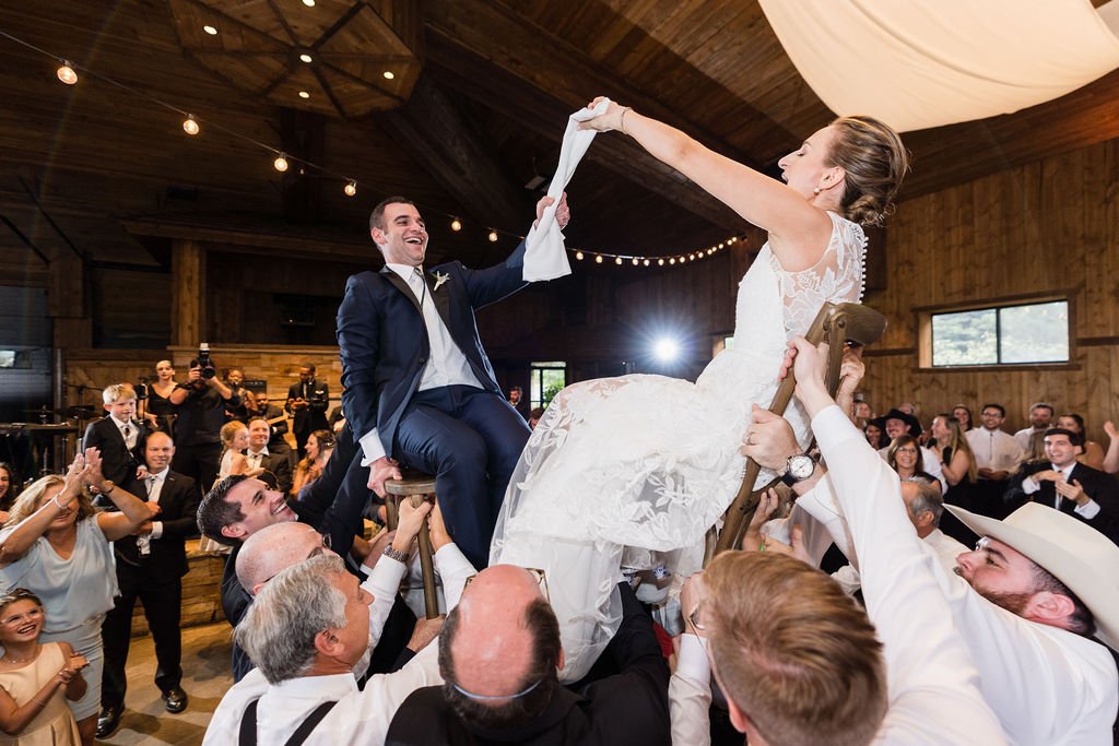 The groom lifted high during a joyful hora